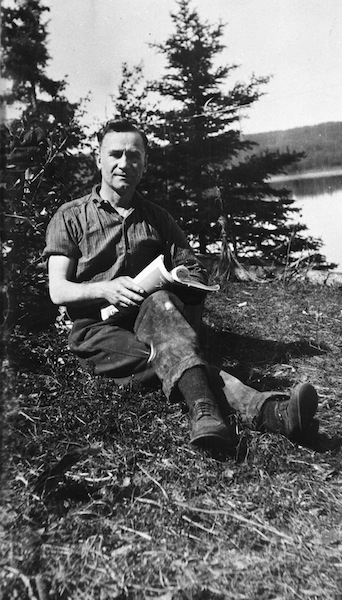 Robert Fitzsimmons relaxing on the banks of the Athabasca River