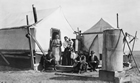 Group at drilling camp, Bow Island, Alberta, ca. 1913-1919; as one driller’s wife remembered, "we would often have to move with two hours’ notice. We moved eleven times in the first eight years. That’s what made life endurable; the unexpected situation would crop up tomorrow. It was a roving life; here today; gone tomorrow…but," she concluded, "I wouldn’t have missed a minute of it." Source: Glenbow Archives, NA-4047-4