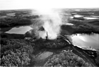 Gas well blowout near New Norway, 1973; fourteen people required hospital care due to the sour gas emitted from this wild well. Source: Provincial Archives of Alberta, J1095.3