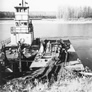 Unloading a barge at the Alberta Government Oil Sands Project, late 1940s<br/>Source: University of Alberta Archives, 83-160-19