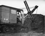 Operating an excavator in the Alberta Government Oil Sands Project quarry, ca. 1950 <br/>Source: Provincial Archives of Alberta, PR1991.0359.39