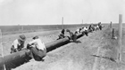 A pipeline under construction between Turner Valley and Calgary; pipelines were used to distribute oil and gas in the 1920s, but only for relatively short distances.