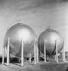 Horton spheres at the Turner Valley gas plant, ca. 1946; the tanks were used to store highly volatile petroleum products extracted from natural gas. The sphere withstands greater pressure than any other shape. <br />Source: Glenbow Archives, IP-14a-1472