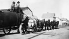 A team of ten horses transports oil well equipment from Okotoks to Turner Valley, Alberta, ca. 1924-1927. Horse teams and wagons were a primary form of transportation for many years in Turner Valley. <br />Source: Glenbow Archives, NA-1234-3