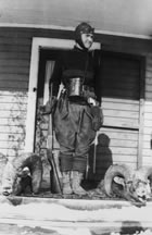 Amanda Colerick stands in front of her Turner Valley home with hunting trophies, 1930. Though hunting was often viewed as a male pursuit in early twentieth-century Alberta, women in the Turner Valley region participated in hunting both as individuals and as members of the elite Polo and Hunt Club. <br />Source: Glenbow Archives, NA-3616-3