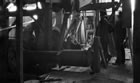Interior of drill shack, likely Dingman No. 1, Turner Valley, ca. 1914-1917; note the walking beam at top, centre. <br />Source: Glenbow Archives, NA-5262-30