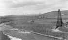 Calgary Petroleum Products site at Turner Valley with Dingman No. 1 in foreground and Dingman No. 2 in middle distance, ca. 1914-1917 <br />Source: Glenbow Archives, NA-5262-50