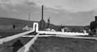 Gas came from the ground at only -6°C (22°F), and caused a thick white layer of frost to form on pipes and processing apparatus at the Turner Valley gas plant (ca. 1930s). <br />Source: Glenbow Archives, NA-67-101