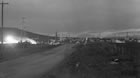 The road through the Turner Valley oil field, Alberta, ca. 1930s; the road network through Turner Valley was ill-suited to handle the increased traffic following the discovery of oil and gas in Turner Valley. Rain and snow made roads difficult to navigate and sometimes completely impassable. <br />Source: Glenbow Archives, NA-67-66