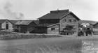 The Log Cabin, Turner Valley, 1927, offered accommodations to workers and was also one of the social hubs in the townsite. <br />Source: Glenbow Archives, PA-3501-102