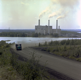A heavy-duty truck hauling coal at the Wabamun surface mining operation near the TransAlta Power Plant demonstrates the advanced mechanization propelling Alberta’s modernizing coal industry in the 1960s