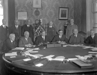 In December 1929, Mackenzie King signs natural resources transfer agreement prior to the passage of legislation in 1930<br/> Source: Provincial Archives of Alberta, A10924