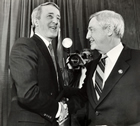 Peter Lougheed, Premier of Alberta, greets Brian Mulroney, Prime Minster of Canada, at a party function in Alberta. Within a year of this meeting, the Government of Canada would negotiate the Western Accord with the governments of Alberta, British Columbia and Saskatchewan, bringing the National Energy Program to an end.