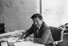 Arne Nielsen, seen here in his Edmonton office in1953,  was a geologist with the Socony Vacuum oil company and one of the geologists responsible for identifying the Pembina oil field.