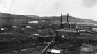 The Royalite Plant, oil derricks and camp buildings, 1927; work camps like this grew around many drilling sites.