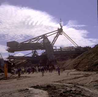 Heavy equipment at an oil sands mine near Fort McMurray, Alberta. Source: Provincial Archives of Alberta, GR1989.0516.394#3