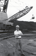 Frank Spragins in front of a Syncrude dragline within an oil sands mining pit. Source: Courtesy of Syncrude Canada Ltd.