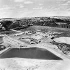 Aerial view of the oil sands pilot plant that Cities Service and partners constructed at Mildred Lake, Alberta, ca. 1960; this small-scale commercial field facility and pilot plant eventually contributed to the creation of the larger-scale Syncrude mega-project in the 1970s. Source: Glenbow Archives, IP-6s-1-1-1