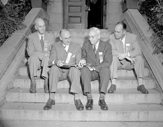 Sidney Kidder, Sidney Blair, George Hume, and Elmer Adkins (l to r) at the Edmonton portion of the Athabasca Oil Sands Conference at the University of Alberta, 1951. Source: Provincial Archives of Alberta, PA3152