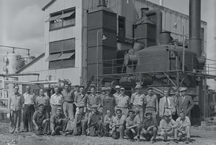 Staff pose outside the new sulfur plant, 1952