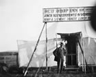 The Dew Drop Inn, near the Dingman No. 1 well, ca. 1914, was an early example of temporary lodging in the oil fields. <br />Source: Glenbow Archives, NA-2491-1