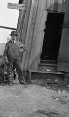 Charles W. Dingman in front of the drill shack at the Dingman No. 1 well, ca. 1914-1917. Charles Dingman, a highly regarded oilman and nephew of Calgary Petroleum Products’ manager A. W. Dingman, was hired by the federal government to provide drilling expertise to oil companies and to aid in enforcing federal drilling regulations. <br />Source: Glenbow Archives, NA-5262-29