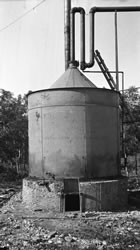 Condenser at the Calgary Petroleum Products gas plant, Turner Valley, Alberta, ca. 1914-1917; equipment at the plant separated the petroleum into its component parts for use and marketing. <br />Source: Glenbow Archives, NA-5262-48