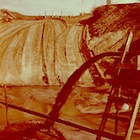 ailings flow into a settling pond in 1951