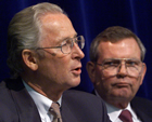 Imperial Oil CEO Bob Peterson (right) listens to Daimler-Chrysler board member Jurgen Hubbert respond to a delegate’s question at the Calgary meeting, June 11, 2000. The World Petroleum Congress draws leaders from the oil industry, as well as from associated industries such as automobile manufacturing.