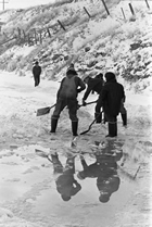Workers clean up following a diesel fuel spill in Nose Creek near Calgary. Although this spill, from a damaged railway tanker, was small, spills of crude oil and refined petroleum products could cause significant environmental damage.