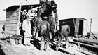 Professor F. H. Edmund of the University of Saskatchewan geology department is supervising  a small, portable drilling rig in use in the Lloydminster oil field, 1944.