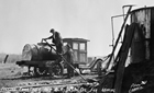 Using large tanks affixed to small trucks was one early method of getting oil to local markets. This example is from Wainwright in the 1920s.