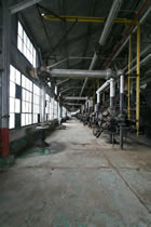 The interior of the compression plant, Turner Valley Gas Plant Provincial Historic Site, shows the range of equipment requiring asbestos remediation and other types of treatment, ca. 2010. <br />Source: Alberta Culture and Tourism
