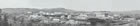 By 1946, when this picture was taken, the Turner Valley gas plant had experienced some major changes. In 1941, a sixth and larger tower, for the new Girbotol scrubbing unit, was added to the existing five towers of the 1935 scrubbing plant to the right of centre. On the higher ground at left are two Horton spheres—high pressure storage tanks for isobutane— erected in 1942. The gasoline plant at left was expanded (1942). A new boiler house, at right with multiple black stacks, was built. No obvious sign remains of Royalite No. 1. <br />Source: Provincial Archives of Alberta, P4734a, b, c