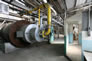 Interior of sulfur plant, showing reaction furnace at left, with panel of gauges beside it, and observation area at right, ca. 2010 <br />Source: Alberta Culture and Tourism