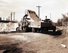 Cooled into solid form, sulfur is shipped by trucks to the railway at Okotoks to be shipped by train to eastern manufacturing centres. <br />Source: Provincial Archives of Alberta, P2973