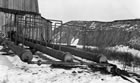 A close up of the natural gas extraction equipment at the Dingman No. 1 well in Turner Valley that was used to separate the various products including naphtha and gasoline, ca. 1914-1917. <br />Source: Glenbow Archives, NA-5262-11