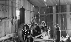 Steam boiler and drill engine at Dingman No. 1 well, Turner Valley, ca. 1914-1917 <br />Source: Glenbow Archives, NA-5262-41