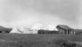 The original Calgary Petroleum Products office (right) and canvas tents, ca. July 1914; the photograph was possibly taken during the visit of the Duke of Connaught, Governor General of Canada. <br />Source: Glenbow Archives, NA-5262-8