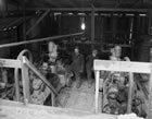 Manning the mud pumps at a Turner Valley rotary drilling rig, n.d. <br />Source: Glenbow Archives, ND-10-153