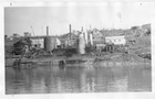 By 1937, tanks, a heater, a pipe still, a cooling tower and a pump house had all been added to the separation plant.<br/>Source:	University of Alberta Archives, Comfort – 84-25 – PAA71.356-4