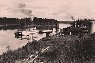 Pushing a barge past Bitumount