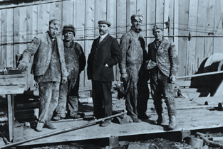 Eugene Coste with a drilling crew