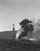 Turner Valley, ca. 1940; without a developed transmission system or even a market, Turner Valley gas was considered incidental surplus and flared. Source: Provincial Archives of Alberta, P1820