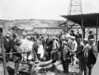 Archibald Dingman, with hand on spigot, gives a tour of the discovery well to the visiting Royal Highnesses the Duke and Duchess of Connaught, July 28, 1914. Source: Glenbow Archives, NA-2119-4