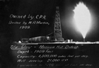 "Old Glory" Gas Well, Bow Island, 1909; the largest gas well in Canada at that time, "Old Glory" was the first major discovery of natural gas in Alberta. Reputedly, Coste discovered that the rig had been constructed on the wrong site before drilling began, but the head driller, Frosty Martin, convinced him to proceed anyway. Later, when drilling was well underway, Martin disagreed again with his boss who had given instructions to cease work at the well as it seemed unproductive. Several days after Coste’s directive had been given and ignored, "Old Glory" blew in. Source: Glenbow Archives, NA-2159-20