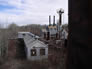 Fractionating tower (tall structure with railing at the top), Alberta Government Oil Sands Project site, 2001<br/>Source: Historic Resources Management, 01-D0001-72 pumphouse