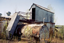 Accumulator tank (left), settler tank (right) and valve control shed (top), Alberta Government Oil Sands Project site, 2005<br/>Source: Historic Resources Management, 05-D0002-65 accumulator tank