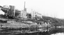 Shoreline of the Athabasca River reinforced with log cribbing to make a secure landing, ca. 1944<br/>Source: University of Alberta Archives, 83-160-83