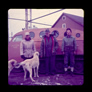 Waiting to board the skidoo outside the warehouse and machine shop, Alberta Government Oil Sands Project, 1952<br/>Source: University of Alberta Archives, 91-137-127